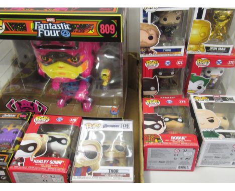 Box containing nine Marvel and DC Funko Pops figures including Thor, Batman, Galactus Black Light etc. 