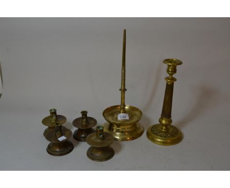 Antique brass Prickett candlestick, 34cms high overall, together with an antique French brass candlestick, 25.5cms high and a