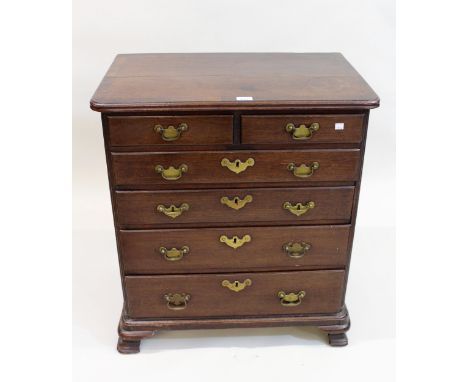 George III mahogany dwarf chest of two short over four long graduated drawers, the crossbanded top with reeded corners and og