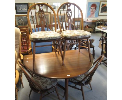 Ercol oval gateleg table together with a set of four Windsor type chairs with Prince of Wales feather backs, together with a 