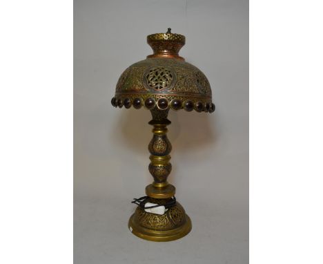 20th Century Turkish pierced brass table lamp with matching shade, 58cms high 