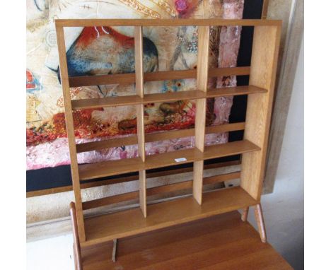 Mid 20th Century light oak open bookcase, raised on shaped supports, 71cms wide x 87cms highIn original un-restored condition