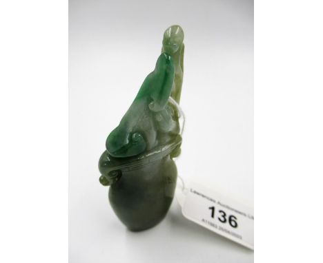 Small 20th Century two colour green jade carving in the form of a two handled vase, 9cm high overall 