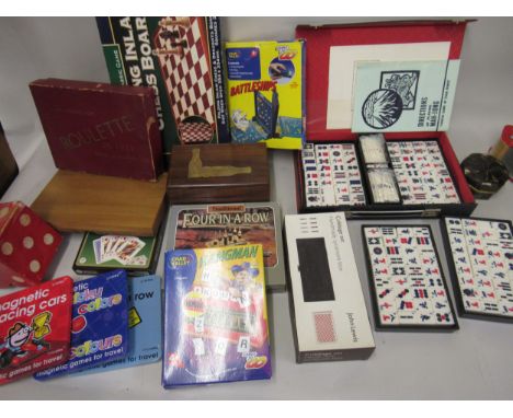 Box containing various childrens games including a 1960's unused Mahjong set with bamboo mounted counters 