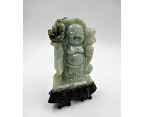 Small 20th Century celadon jade figure of a standing Buddha, 9cm high with hardwood stand 