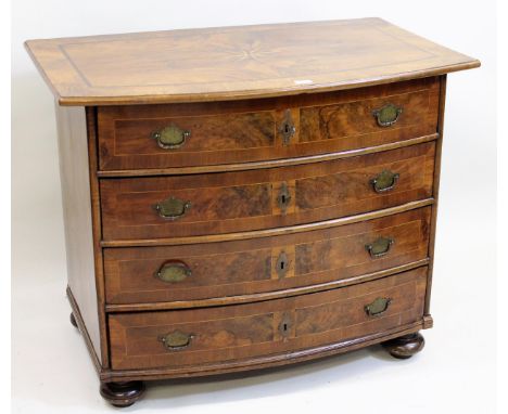18th Century Continental figured walnut and inlaid commode, the crossbanded and line inlaid top above four drawers with brass