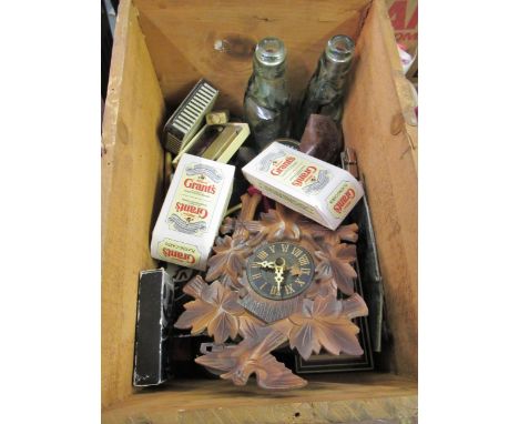 Wooden box containing a collection of  miscellaneous items including a miniature cuckoo clock, playing cards, Dunhill lighter