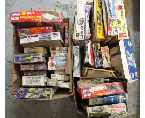 Two boxes containing thirty four unmade plastic aircraft kits, including Airfix, Italari, Revel and Esci 
