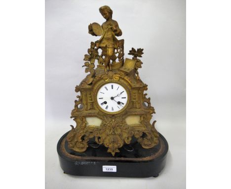 19th Century French gilded spelter mantel clock with a figure surmount, the enamel dial with Roman numerals and two train mov