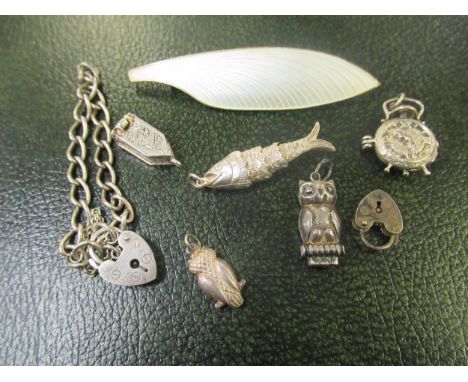 Danish sterling silver enamel decorated feather brooch, makers mark VB together with a silver bracelet and various charms 