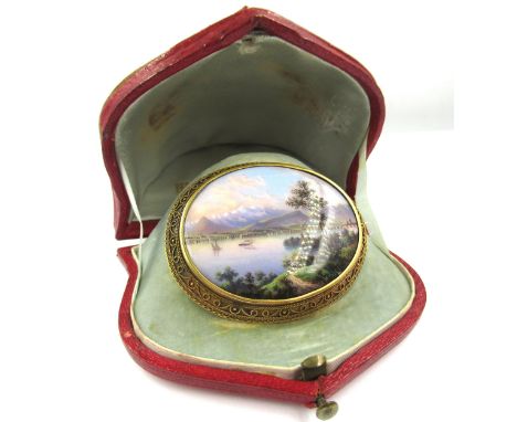 19th Century oval gold and mounted painted enamel brooch depicting lake scene, with steam and sailing boats, housed in origin