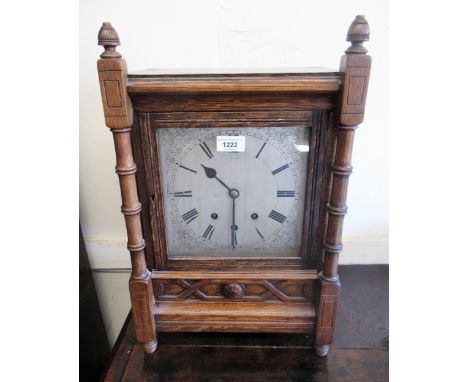 Arts & Crafts oak cased bracket clock, the silvered dial with Roman numerals and three train movement striking on bells and g