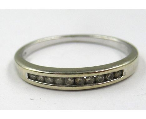 18ct White gold ring, channel set with small diamonds, size N 