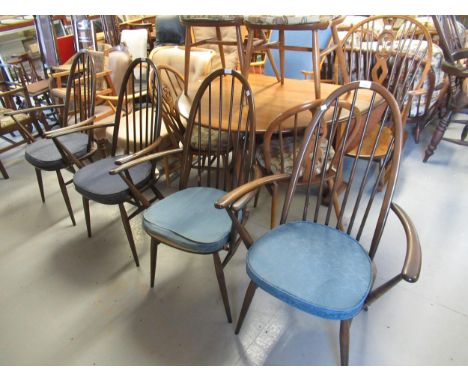 Set of four Ercol dark stained stickback elbow chairs, together with a similar pale beechwood open armchair (unmarked) 