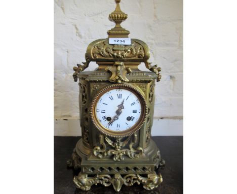 19th Century French gilt brass mantel clock, the enamel dial with Arabic and Roman numerals and two train movement, 37cms hig
