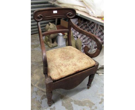 George III mahogany commode open elbow chair and an Edwardian upholstered low seat elbow chair raised on ebonised tapering su