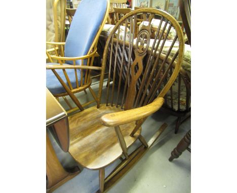 Mid 20th Century dark stained hoop and stickback rocking chair of Ercol type 