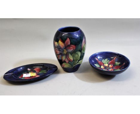 Moorcroft vase, the floral tube line decoration on blue ground (small hairline crack), Moorcroft floral decorated dish with o