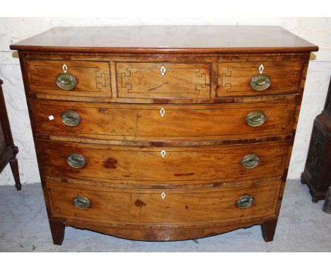 George III mahogany chequer banded and line inlaid bow front chest of three short and three long drawers, with ivory escutche