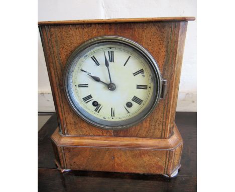 19th Century Continental walnut mantel clock, the circular enamel dial with Roman numerals, with a two train movement strikin