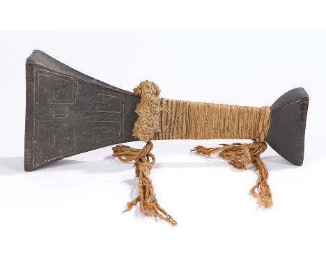 Guyana macana club, Amazon Basin, of waisted form and incised decorated head and strung grip, 35cm high