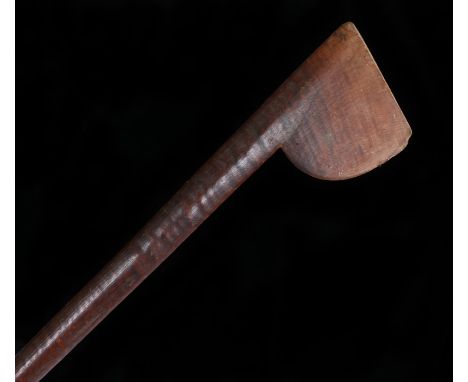 19th Century Tewhatewha club, the axe type head above a tapering shaft and carved three quarters way down towards the pointed