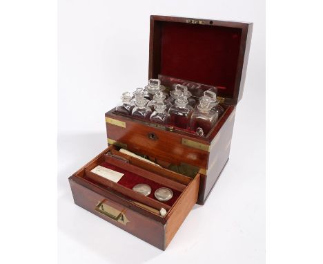 19th Century mahogany and brass bound travelling doctors box, the top tier containing eleven bottles, the frieze drawer with 