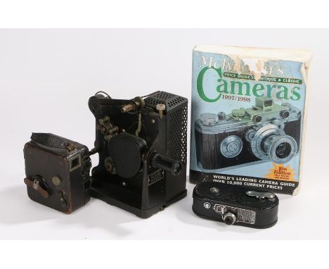 Kodascope model D cine projector, together with a Keystone cine camera, McKeowns camera price guide 1997 and a Moto cine came