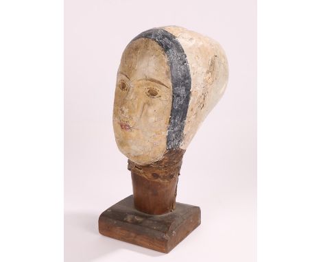 19th Century French papier mache mannequin head, near life size raised on a plinth base, 34cm high