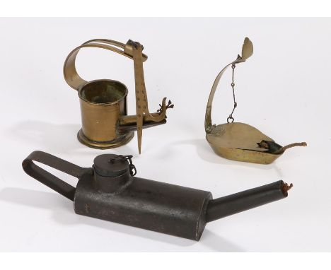 Three oil lamps, to include two cruises, lamp a betty lamp and an elongated example, (3)