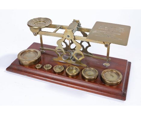 S Mordan &amp; Co, London brass letter scales on a mahogany plinth base, together with a graduated set of seven brass weights