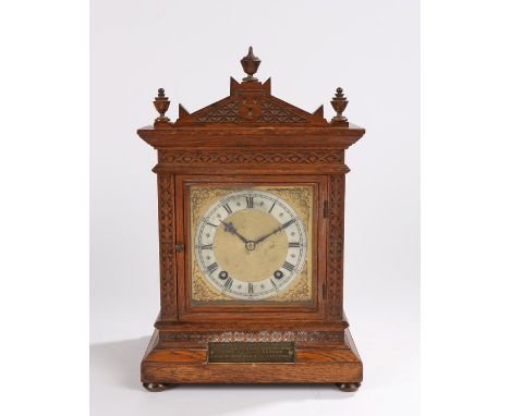 Winterhalder &amp; Hofmeier oak cased mantel clock, the triangular pediment with turned finials, the dial with foliate spandr