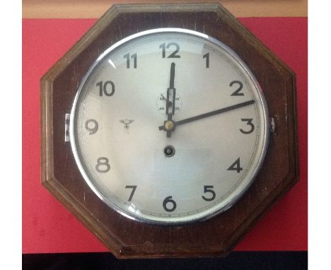 A Third Reich Octagonal wall clock. This is part of my own collection. The clock worked and kept good time up until a couple 