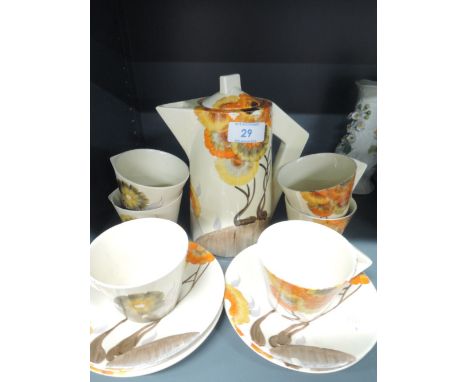 A deco coffee service from Clarice Cliff Newport pottery Reg No 7622772 cups have hairline cracks inside, 1 saucer has a smal