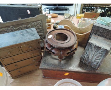 A selection of treen wooden items including chest of drawers and pipe rack