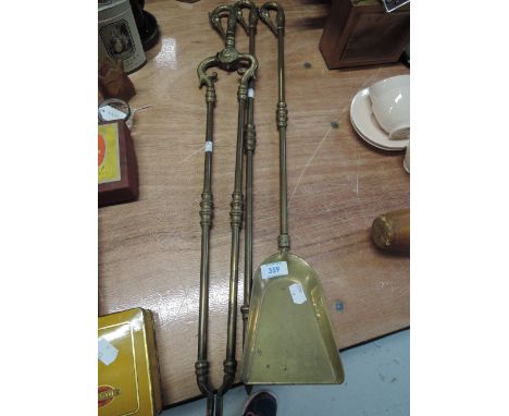 A selection of vintage brass fire tools, having phoenix handles