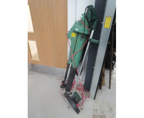 A selection of gardening tools including leaf blower and strimmer