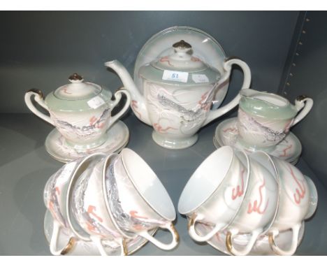 An oriental dragon design part tea service 