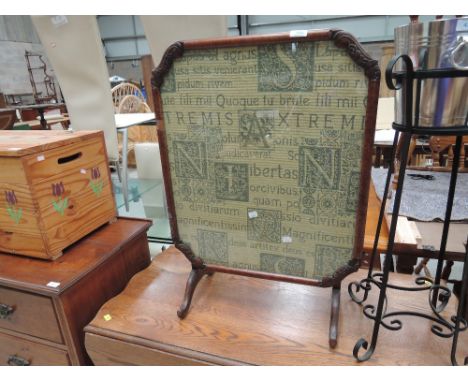 A folding table firescreen with fabric inlay 