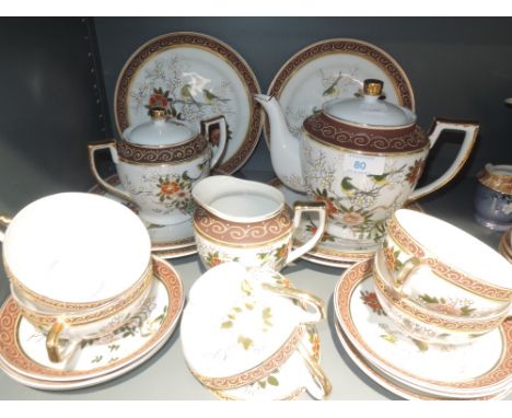 A part hand painted oriental tea service with lithophane geisha in cups