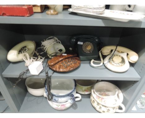 A selection of various telephones including simulated wood and Genie and GPO