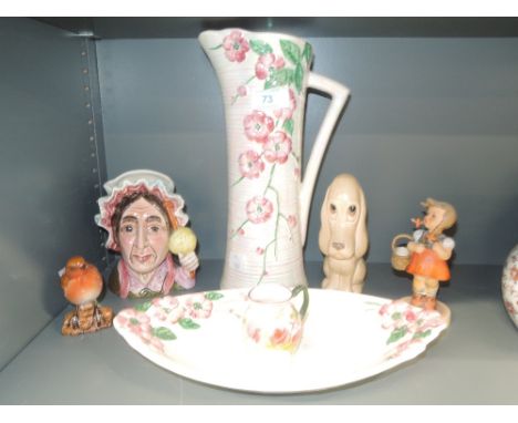 A selection of ceramics including Maling lustre vase and dish, Sylvac dog study, Goebel figurine, Beswick character jug Betsy