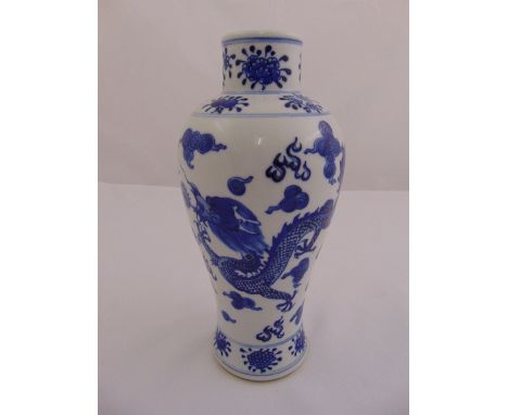 A Chinese blue and white baluster vase decorated with dragons chasing a flaming pearl, 25.5cm (h)