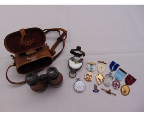 A quantity of collectables to include a pair of WWI Dollond Binoculars, a WWII military compass, two enamel military badges, 