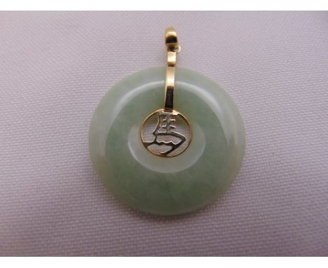 A Chinese jade and 14ct yellow gold pendant