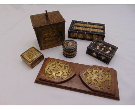 A quantity of collectables to include porcupine quill caskets, a rectangular hand hammered copper tea caddy and a book slide 