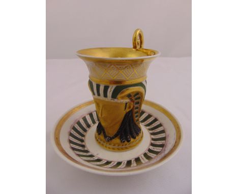 Royalware hand painted cabinet cup and saucer in the Egyptian style with gilded highlights, 11.5cm (h)