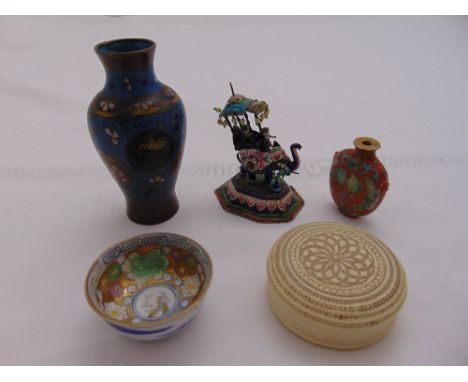 A quantity of oriental collectables to include a white metal and enamel elephant, a cloisonné‚ vase, a tea bowl, a snuff bott