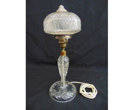 Cut glass table lamp of baluster form on raised circular base with detachable cut glass shade, 41.5cm (h)