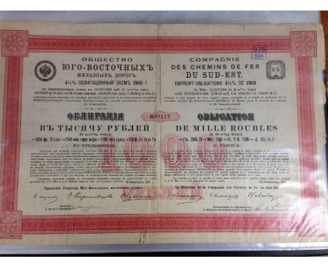 A COLLECTION OF SHARE, BOND, DEBENTURE AND SIMILAR CERTIFICATES IN LARGE BINDER, MANY RAILWAY RELATED, RUSSIAN, LATIN AMERICA